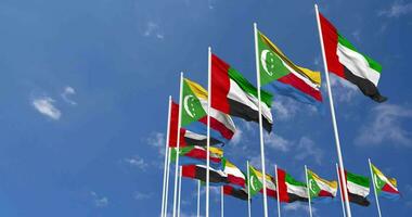 Comoros and United Arab Emirates, UAE Flags Waving Together in the Sky, Seamless Loop in Wind, Space on Left Side for Design or Information, 3D Rendering video