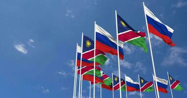 Namibia and Russia Flags Waving Together in the Sky, Seamless Loop in Wind, Space on Left Side for Design or Information, 3D Rendering video