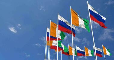 Ivory Coast and France Flags Waving Together in the Sky, Seamless Loop in Wind, Space on Left Side for Design or Information, 3D Rendering video