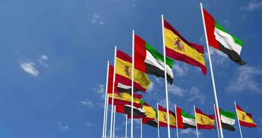 Spain and United Arab Emirates, UAE Flags Waving Together in the Sky, Seamless Loop in Wind, Space on Left Side for Design or Information, 3D Rendering video