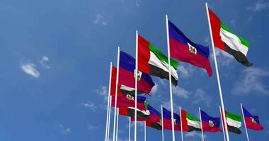 Haiti and United Arab Emirates, UAE Flags Waving Together in the Sky, Seamless Loop in Wind, Space on Left Side for Design or Information, 3D Rendering video