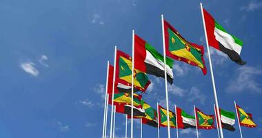 Granada y unido árabe emiratos, uae banderas ondulación juntos en el cielo, sin costura lazo en viento, espacio en izquierda lado para diseño o información, 3d representación video