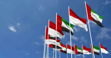 Indonesia and United Arab Emirates, UAE Flags Waving Together in the Sky, Seamless Loop in Wind, Space on Left Side for Design or Information, 3D Rendering video