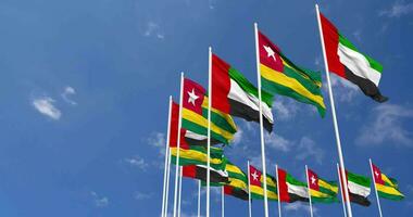 Togo and United Arab Emirates, UAE Flags Waving Together in the Sky, Seamless Loop in Wind, Space on Left Side for Design or Information, 3D Rendering video
