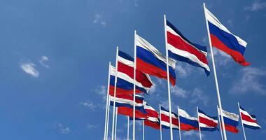 Costa Rica and France Flags Waving Together in the Sky, Seamless Loop in Wind, Space on Left Side for Design or Information, 3D Rendering video