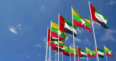 Myanmar, Burma and United Arab Emirates, UAE Flags Waving Together in the Sky, Seamless Loop in Wind, Space on Left Side for Design or Information, 3D Rendering video