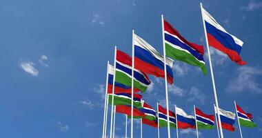 Gambia and France Flags Waving Together in the Sky, Seamless Loop in Wind, Space on Left Side for Design or Information, 3D Rendering video