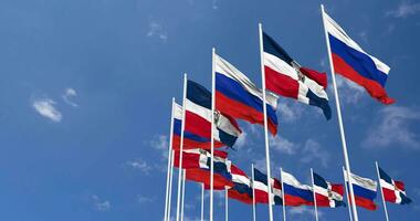 Dominican Republic and France Flags Waving Together in the Sky, Seamless Loop in Wind, Space on Left Side for Design or Information, 3D Rendering video