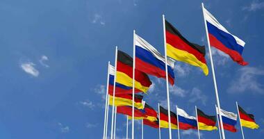 Alemanha e França bandeiras acenando juntos dentro a céu, desatado ciclo dentro vento, espaço em esquerda lado para Projeto ou Informação, 3d Renderização video