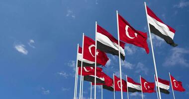 Turquía y Yemen banderas ondulación juntos en el cielo, sin costura lazo en viento, espacio en izquierda lado para diseño o información, 3d representación video