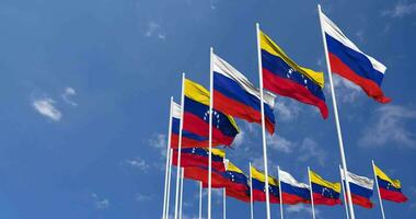 bolivariano repubblica di Venezuela e Francia bandiere agitando insieme nel il cielo, senza soluzione di continuità ciclo continuo nel vento, spazio su sinistra lato per design o informazione, 3d interpretazione video