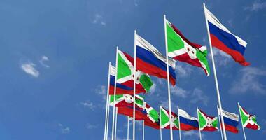 Burundi and France Flags Waving Together in the Sky, Seamless Loop in Wind, Space on Left Side for Design or Information, 3D Rendering video