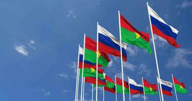 Burkina Faso and France Flags Waving Together in the Sky, Seamless Loop in Wind, Space on Left Side for Design or Information, 3D Rendering video