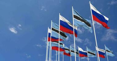 Botswana and France Flags Waving Together in the Sky, Seamless Loop in Wind, Space on Left Side for Design or Information, 3D Rendering video