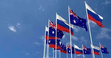 Australia y Francia banderas ondulación juntos en el cielo, sin costura lazo en viento, espacio en izquierda lado para diseño o información, 3d representación video