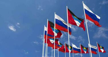 Antigua and Barbuda and France Flags Waving Together in the Sky, Seamless Loop in Wind, Space on Left Side for Design or Information, 3D Rendering video