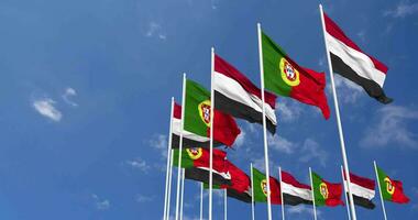 Portugal and Yemen Flags Waving Together in the Sky, Seamless Loop in Wind, Space on Left Side for Design or Information, 3D Rendering video