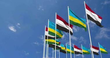 Rwanda and Yemen Flags Waving Together in the Sky, Seamless Loop in Wind, Space on Left Side for Design or Information, 3D Rendering video