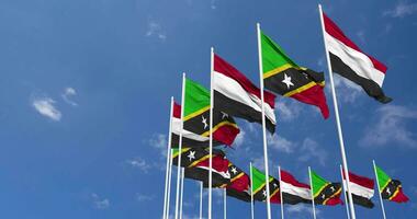 Saint Kitts and Nevis and Yemen Flags Waving Together in the Sky, Seamless Loop in Wind, Space on Left Side for Design or Information, 3D Rendering video
