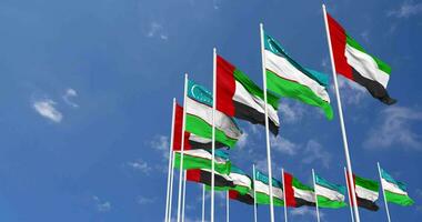 Uzbekistan and United Arab Emirates, UAE Flags Waving Together in the Sky, Seamless Loop in Wind, Space on Left Side for Design or Information, 3D Rendering video