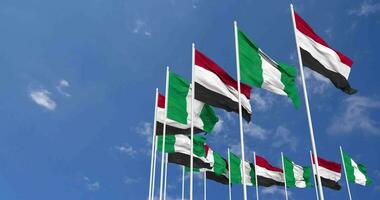 Nigeria y Yemen banderas ondulación juntos en el cielo, sin costura lazo en viento, espacio en izquierda lado para diseño o información, 3d representación video