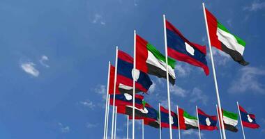 Laos and United Arab Emirates, UAE Flags Waving Together in the Sky, Seamless Loop in Wind, Space on Left Side for Design or Information, 3D Rendering video