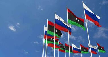 Libya and France Flags Waving Together in the Sky, Seamless Loop in Wind, Space on Left Side for Design or Information, 3D Rendering video