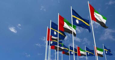 Nauru and United Arab Emirates, UAE Flags Waving Together in the Sky, Seamless Loop in Wind, Space on Left Side for Design or Information, 3D Rendering video