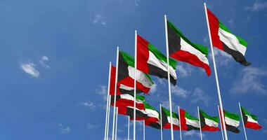 Kuwait y unido árabe emiratos, uae banderas ondulación juntos en el cielo, sin costura lazo en viento, espacio en izquierda lado para diseño o información, 3d representación video