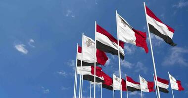 Malta and Yemen Flags Waving Together in the Sky, Seamless Loop in Wind, Space on Left Side for Design or Information, 3D Rendering video