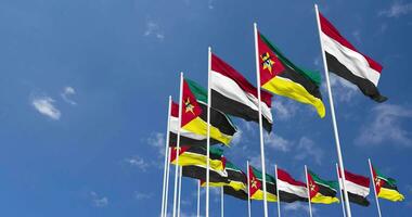 Mozambique and Yemen Flags Waving Together in the Sky, Seamless Loop in Wind, Space on Left Side for Design or Information, 3D Rendering video