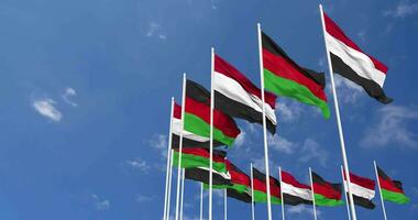 malawi e Iémen bandeiras acenando juntos dentro a céu, desatado ciclo dentro vento, espaço em esquerda lado para Projeto ou Informação, 3d Renderização video