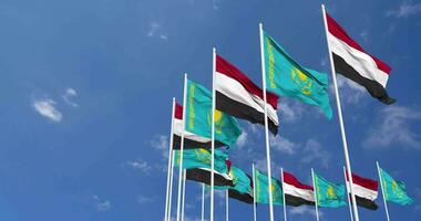 Kazakhstan and Yemen Flags Waving Together in the Sky, Seamless Loop in Wind, Space on Left Side for Design or Information, 3D Rendering video