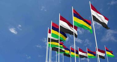 Mauritius and Yemen Flags Waving Together in the Sky, Seamless Loop in Wind, Space on Left Side for Design or Information, 3D Rendering video