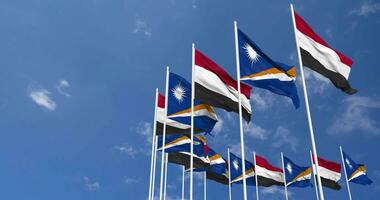 Marshall Islands and Yemen Flags Waving Together in the Sky, Seamless Loop in Wind, Space on Left Side for Design or Information, 3D Rendering video