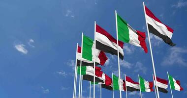 Italia y Yemen banderas ondulación juntos en el cielo, sin costura lazo en viento, espacio en izquierda lado para diseño o información, 3d representación video