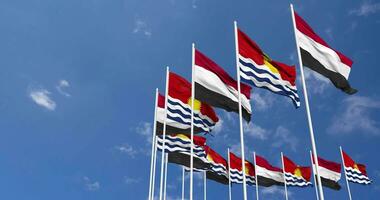 Kiribati and Yemen Flags Waving Together in the Sky, Seamless Loop in Wind, Space on Left Side for Design or Information, 3D Rendering video