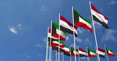 Kuwait und Jemen Flaggen winken zusammen im das Himmel, nahtlos Schleife im Wind, Raum auf links Seite zum Design oder Information, 3d Rendern video