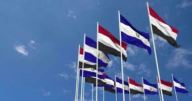 El Salvador and Yemen Flags Waving Together in the Sky, Seamless Loop in Wind, Space on Left Side for Design or Information, 3D Rendering video