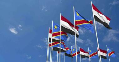 DR Congo and Yemen Flags Waving Together in the Sky, Seamless Loop in Wind, Space on Left Side for Design or Information, 3D Rendering video