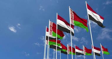 Belarus and Yemen Flags Waving Together in the Sky, Seamless Loop in Wind, Space on Left Side for Design or Information, 3D Rendering video