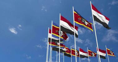 Eswatini e Iémen bandeiras acenando juntos dentro a céu, desatado ciclo dentro vento, espaço em esquerda lado para Projeto ou Informação, 3d Renderização video