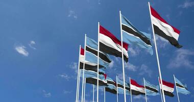 Botswana and Yemen Flags Waving Together in the Sky, Seamless Loop in Wind, Space on Left Side for Design or Information, 3D Rendering video