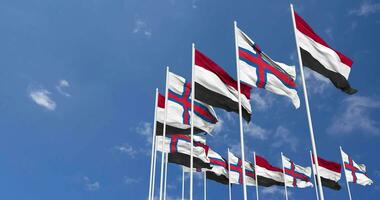 faroe öar och jemen flaggor vinka tillsammans i de himmel, sömlös slinga i vind, Plats på vänster sida för design eller information, 3d tolkning video