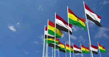 Bolivia and Yemen Flags Waving Together in the Sky, Seamless Loop in Wind, Space on Left Side for Design or Information, 3D Rendering video