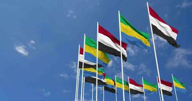 Gabon and Yemen Flags Waving Together in the Sky, Seamless Loop in Wind, Space on Left Side for Design or Information, 3D Rendering video