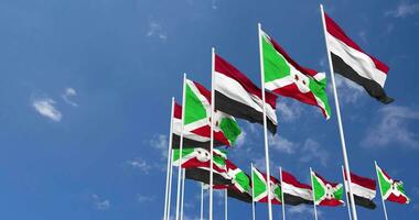 Burundi and Yemen Flags Waving Together in the Sky, Seamless Loop in Wind, Space on Left Side for Design or Information, 3D Rendering video