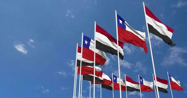 Chile and Yemen Flags Waving Together in the Sky, Seamless Loop in Wind, Space on Left Side for Design or Information, 3D Rendering video