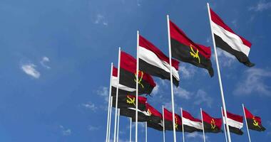 Angola and Yemen Flags Waving Together in the Sky, Seamless Loop in Wind, Space on Left Side for Design or Information, 3D Rendering video