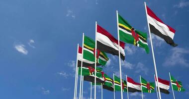 Dominica and Yemen Flags Waving Together in the Sky, Seamless Loop in Wind, Space on Left Side for Design or Information, 3D Rendering video